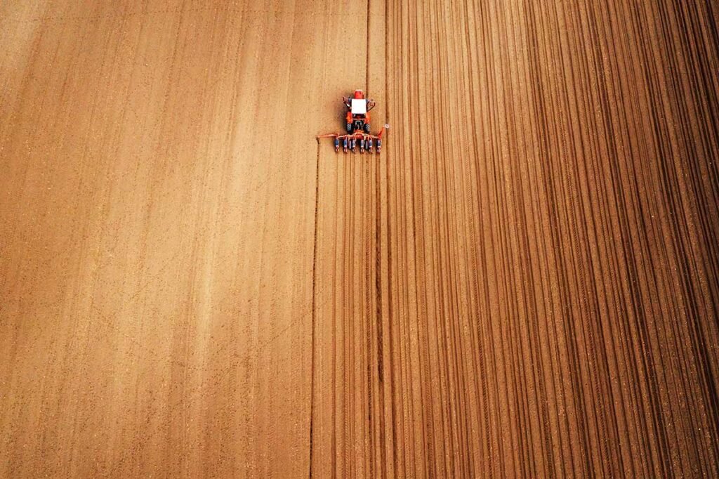 drone photography of tractor with seeder working i 2021 08 26 23 02 45 utc.jpg